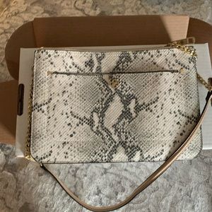 Crossbody purse with snakeskin and tan treatment